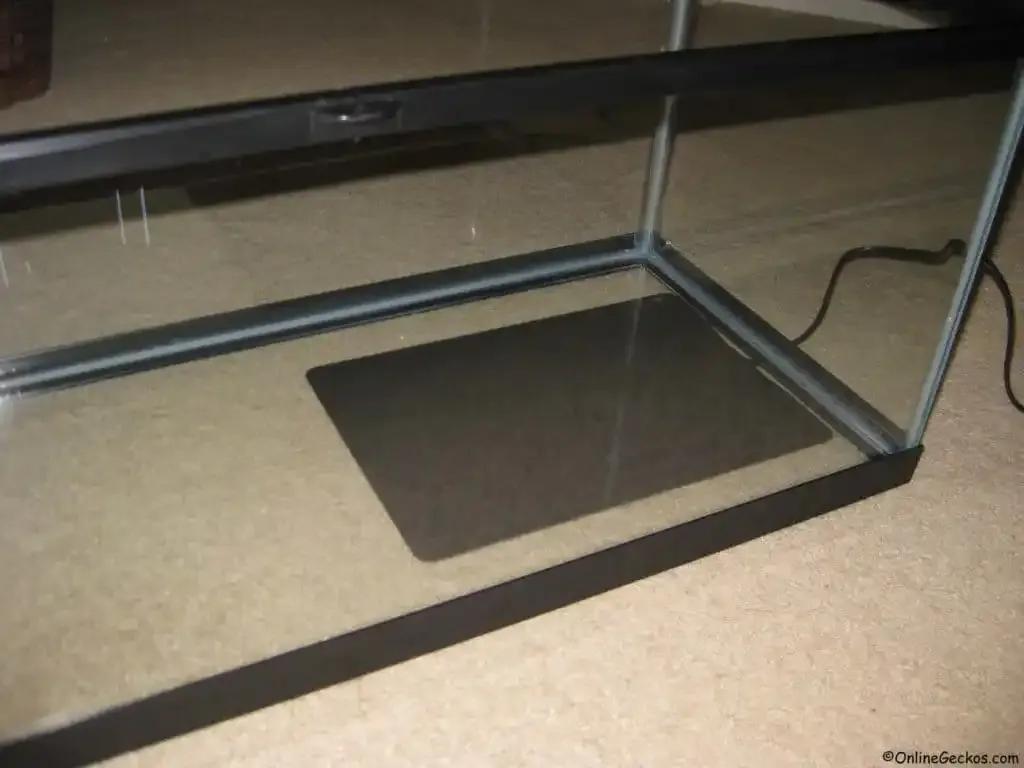 Heat mat under an enclosure tank
